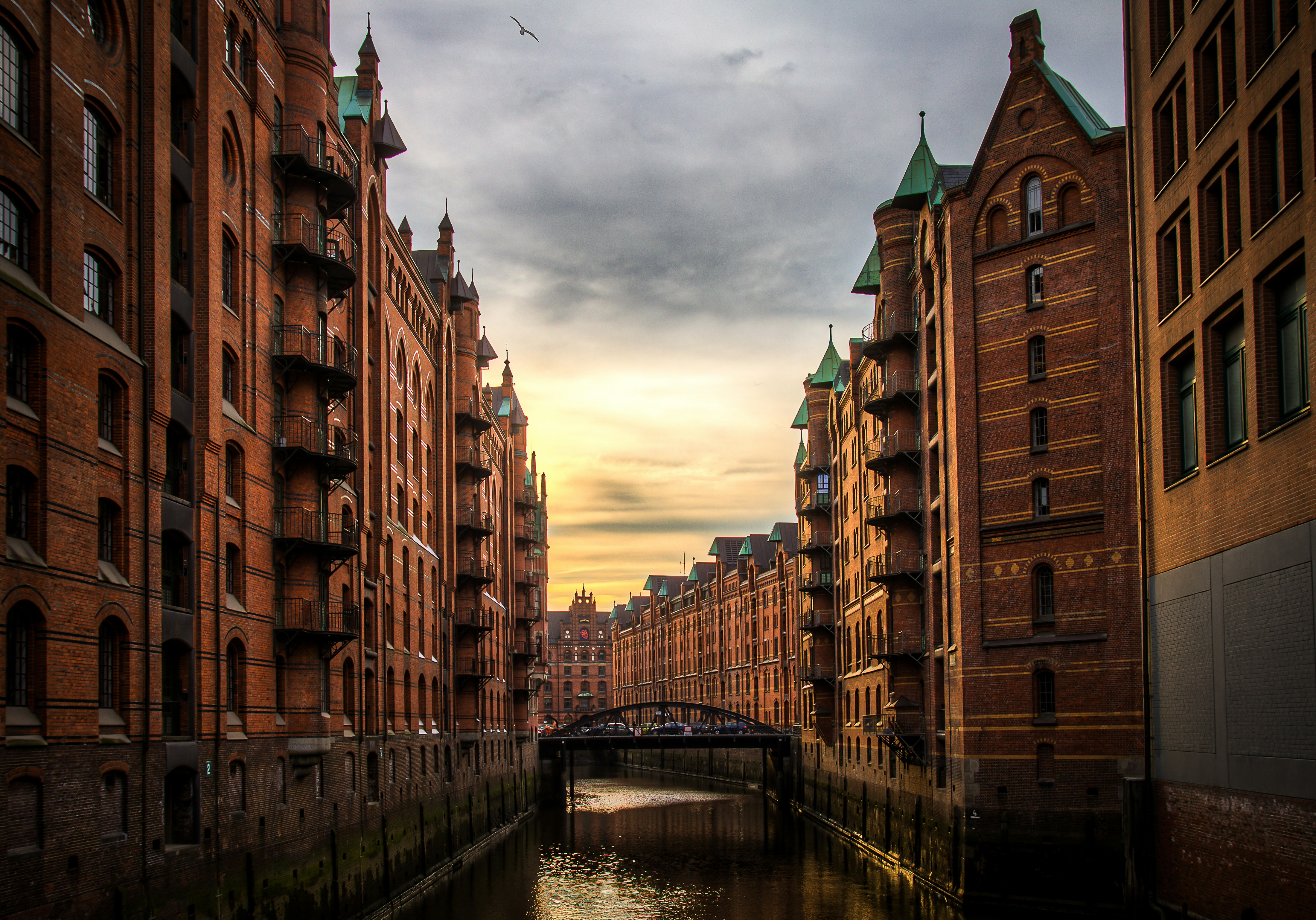 river between brown concrete buildings